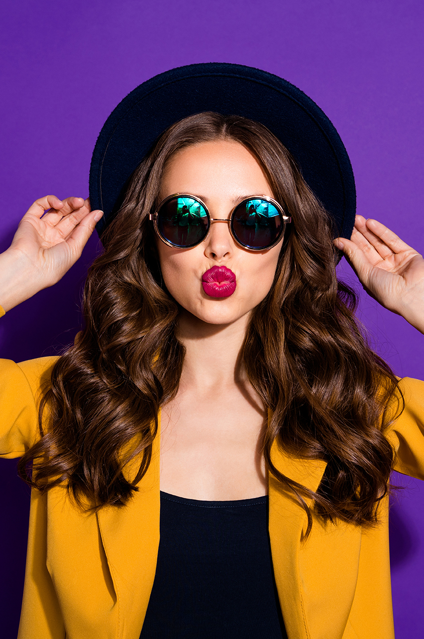 Woman wearing stylish sunglasses